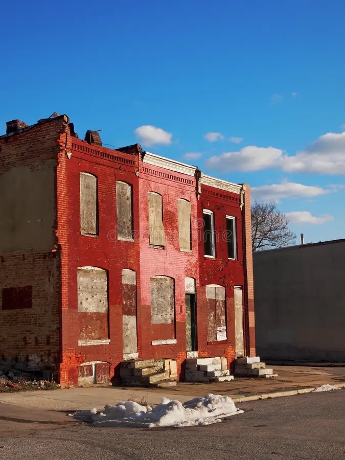 Distressed brick row house